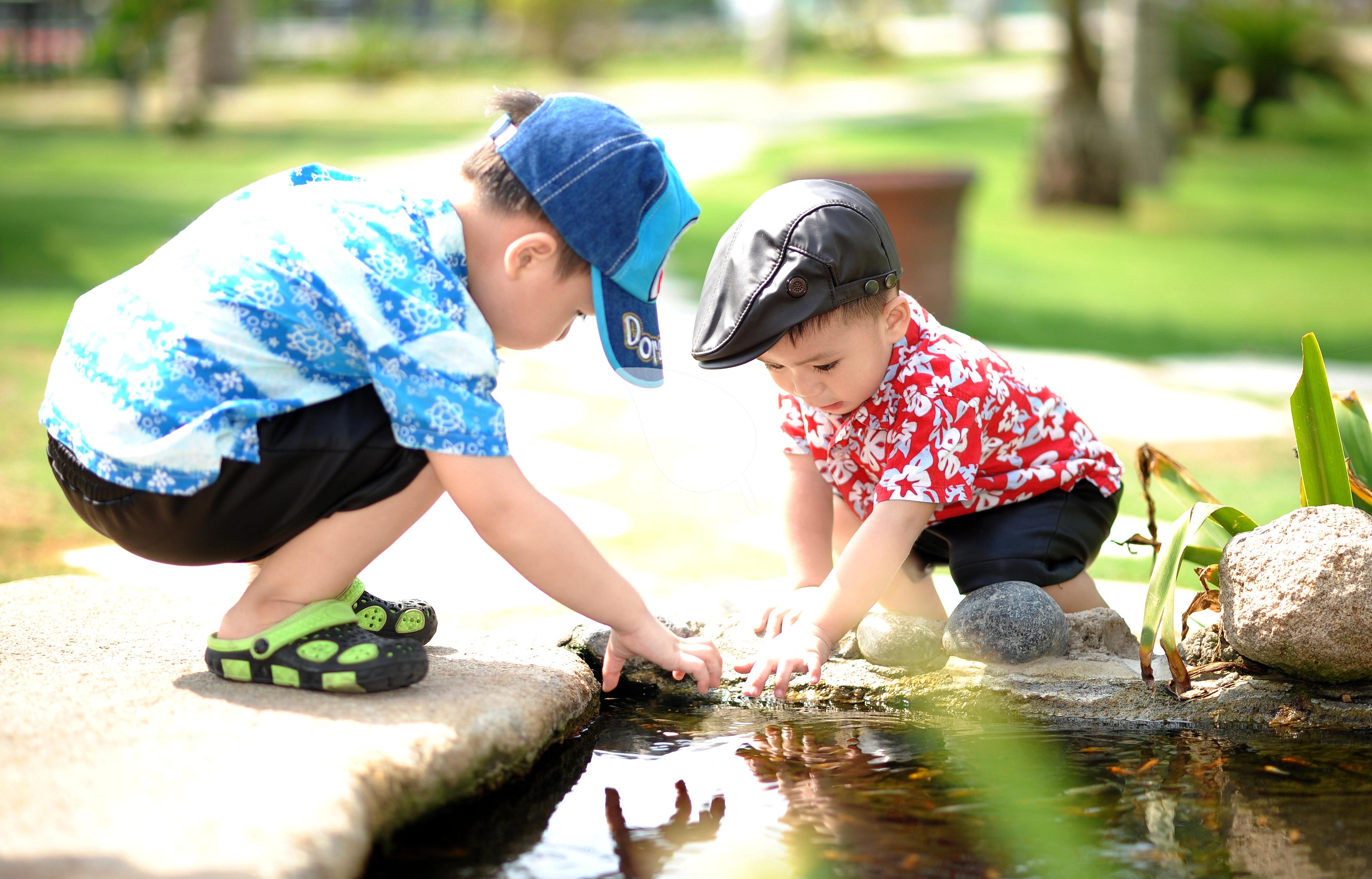 Children showing prosocial behavior in outdoor setting