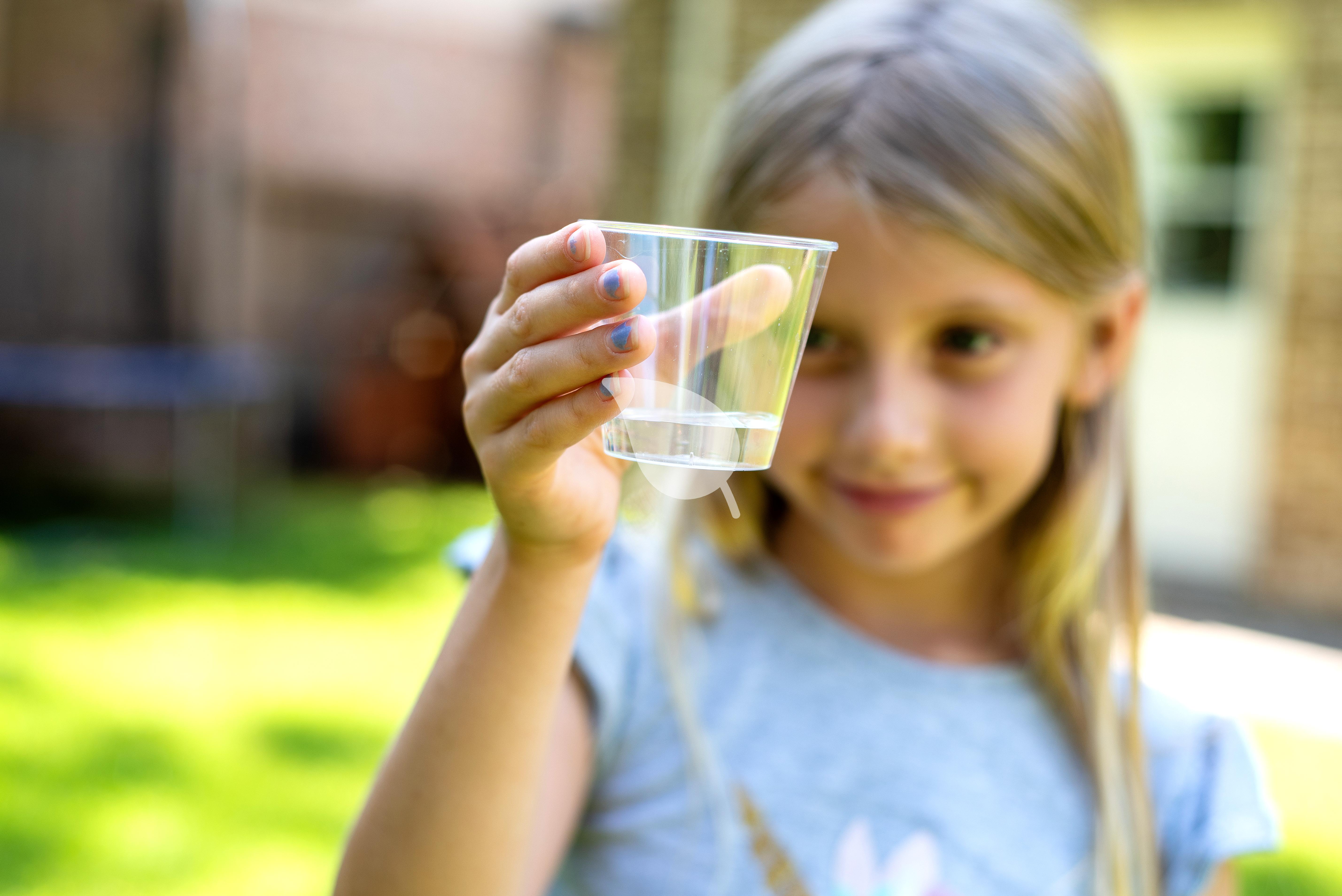 Child checking light switches to save energy
