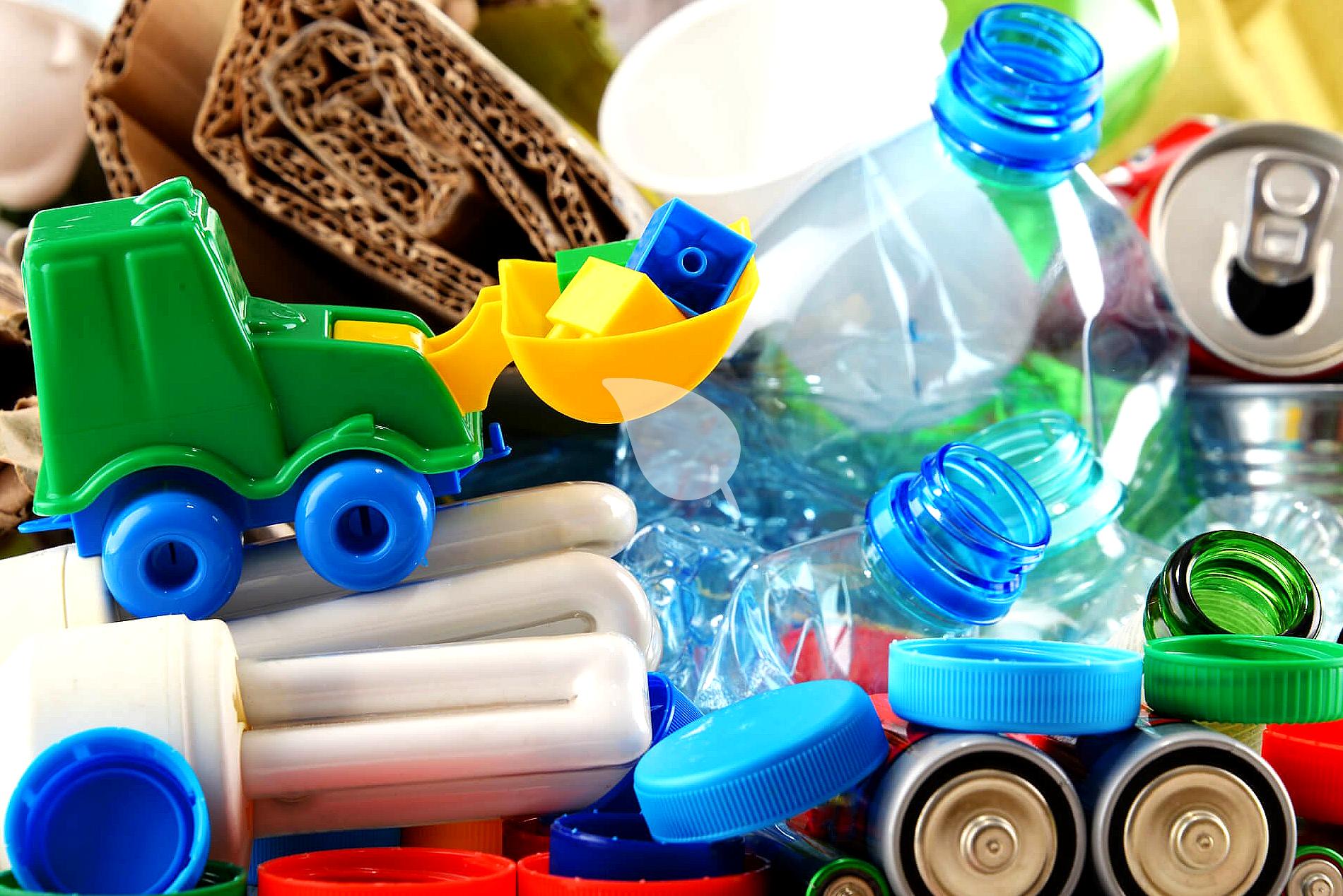 Pile of old toys being sorted for eco-friendly disposal