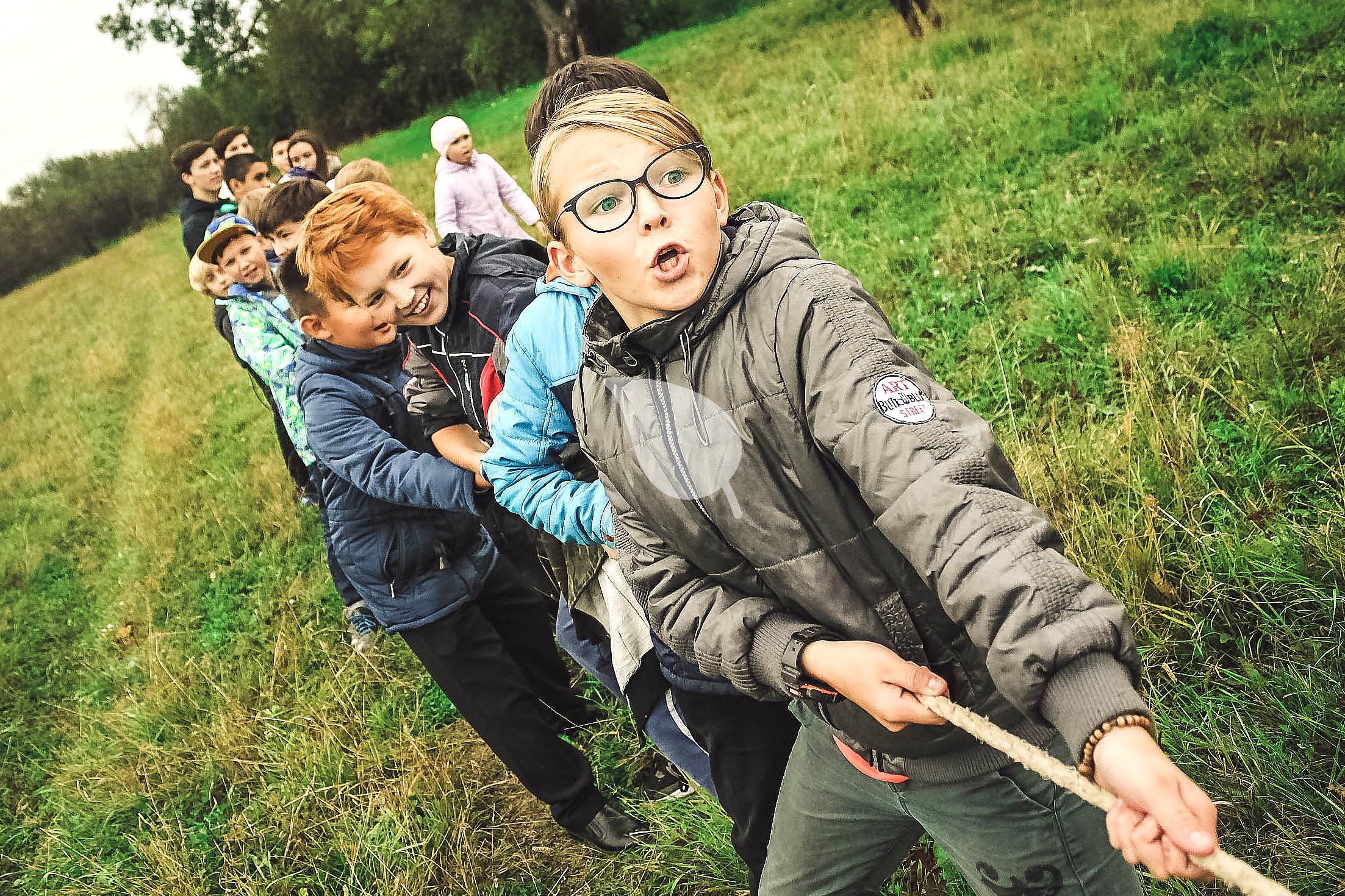 Children playing eco-friendly nature scavenger hunt